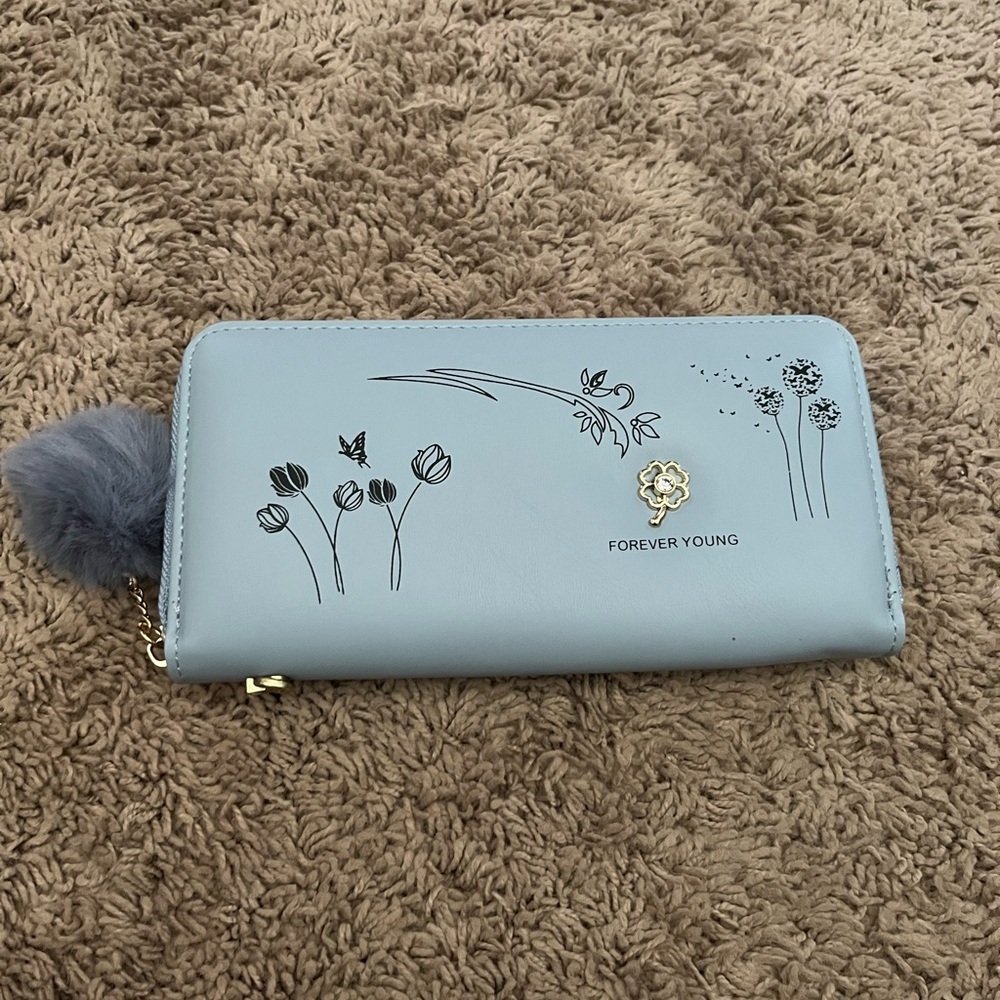 Women’s blue leather clutch pocket book
